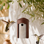 Vogelhuisje rond van houtbeton