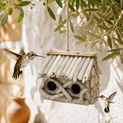 Vogelhuisje rustiek van stammen met dubbel ingang